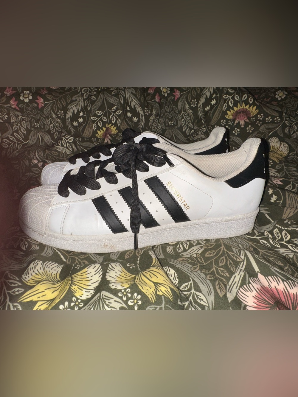 Adidas White and Black Superstar Sneakers with Gold Accent